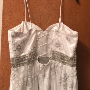 Size14 prom, wedding,cocktail dress it’s has light  purple flowers on it.